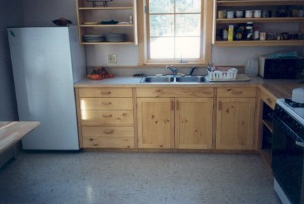 Kitchen designed for future wheelchair use. Doors lift off, kickspace pops off, and the flooring already runs back to the wall. Mouse over to see it accessible IBW.